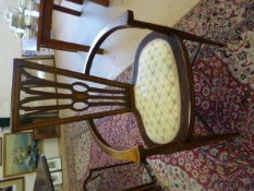 Unusual shaped open armed chair with inlay. Triangular shaped splat back with an oval shaped