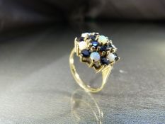 Vintage 9ct (1975) Gold Opal and Sapphire cluster dress ring. 7 Cabachon opals approx 3mm in
