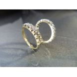 Two 9ct Gold Eternity Rings. (1) 9ct White Gold 3mm Wide band, full eternity ring set with 22