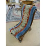 Victorian needle point nursing chair on scrolled legs and turned wooden stretchers