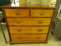 Tall pine chest of five drawers with brass handles