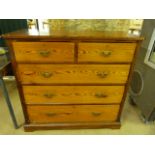 Tall pine chest of five drawers with brass handles