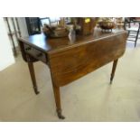 Mahogany drop leaf side table with single drawer on castors