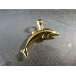 An 18ct Yellow Gold Dolphin pendant set with a small Ruby stone for the Eye.The chunky Bale is