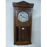 Oak antique hanging wall clock with three bevelled glass panels to front - key in office