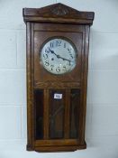 Oak antique hanging wall clock with three bevelled glass panels to front - key in office