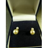 9ct Gold Cultured Pearl earrings hallmarked on the prong terminating with an approx 3.7mm stone with