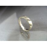 9ct White Gold approx 4mm wide wedding band. The ring has three diagonal lines set with three