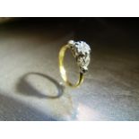 18ct Yellow Gold ring set with large central old Mine Cut Diamond and flanked by 4 smaller diamond
