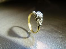 18ct Yellow Gold ring set with large central old Mine Cut Diamond and flanked by 4 smaller diamond