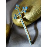 Gold coloured tie clip in the form of a Cross inset with Turquoise cabachons marked Depose to back
