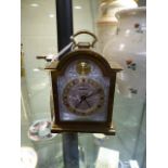 Miniature brass cased carriage clock by Swiza with Silvered face and a Gold chapter with Roman