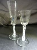 Two Georgian Cordial glasses with white spiral decoration to stem. Bubbles fleck in various places
