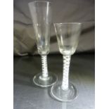 Two Georgian Cordial glasses with white spiral decoration to stem. Bubbles fleck in various places