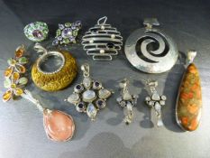 Collection of Semi-Precious stones with silver mounts. Mostly silver pendants to include stones such