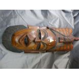 African Tribal mask inlaid with ivory decoration and eagle motif to top