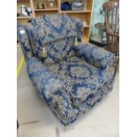 Blue and Gilt coloured upholstered single chair with headrest on wooden legs with castors