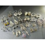 Approx 20 pairs of silver earrings and other small scrap pieces of silver. All hallmarked 925 -