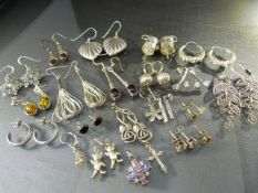 Approx 20 pairs of silver earrings and other small scrap pieces of silver. All hallmarked 925 -