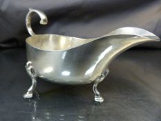 George V silver sauce boat hallmarked Sheffield 1925 with scroll handle and three hoof feet weight