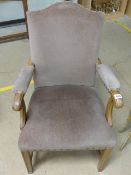 Mahogany open arm upholstered armchair along with another oak shield back hall chair