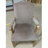 Mahogany open arm upholstered armchair along with another oak shield back hall chair