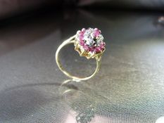 9ct Gold Diamond Ruby and Diamond dress ring. The Marquise shaped cluster measures approx 15.10mm