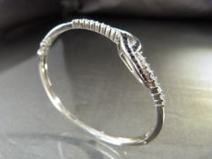 Good Quality Silver (925) Black and White CZ crossover style bangle approx 3.5mm wide and approx