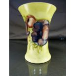 Moorcroft - Green ground vase with tube lined decoration of purple and blue flowers height -