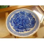 Blue and White Earthenware plate with hand pained floral decoration - slightly uneven in shape