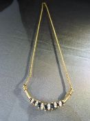 18ct Gold (750) Sapphire and Diamond necklace, 18" Long. A Central group of 7 graduated Marquise