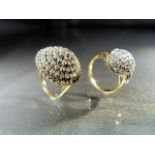 Two Diamond multi stone cluster Rings. (1) 9ct Gold Target cluster ring with 5 rings of small