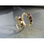 Two 9ct Gold Gem set dress rings. (1)9ct Gold 5 graduated Garnet Half Hoop dress ring. Size approx