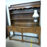 18th/19th Century oak dresser with two tier plate rack, above another ornamental Pot Shelf. Below,