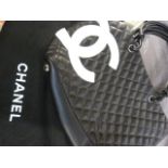 CoCo Chanel leather quilted handbag. Leather Strap handles with neon pink lining. 5 round studded