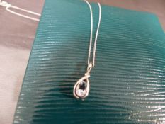 9ct White gold chain set with a 9ct white gold tear drop pendant. Total weight approx 2g in Ernest