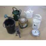 Three vintage metal watering cans, enamelled candle holder and another cast metal modern. along with