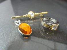 Gold plated ring set with white stone, Gold plated brooch set with white stone and a small pendant
