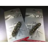 Two Victorinox 15 function original Swiss Army Knives in Camo colour. Unopened in casing.