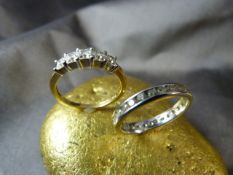 Two 18ct Gold CZ set rings. (1) White Gold full ET ring set with 29 brilliant cut CZ stones. (2)