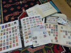 Box containing various stamps to include a first day cover