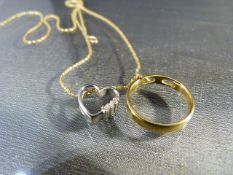 9ct Gold chain with hanging double pendant. The circular pendant has a hanging heart set with