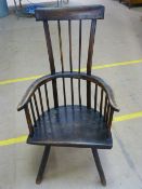 An Antique welsh comb back chair in Ash and poss Fruitwood with curved top rail. Thick odd shaped