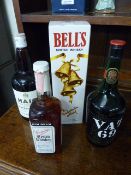 Four bottles of modern Whiskys 'Jim Beam', Bells scotch whisky etc