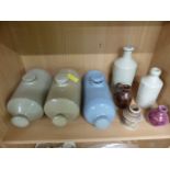 Box containing various stoneware hot water bottles