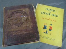 The Lincoln stamp Album with various stamps from around the world along with a book on French for