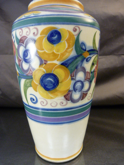 A 1930`s Poole Pottery Vase decorated in the YO pattern with coloured stylised flower heads and - Image 3 of 10