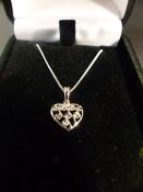 Platinum filigree heart shaped pendant approx 10.67mm wide x 16mm including the bale. Hung from a