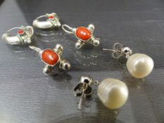 Three pairs of earrings - Two pairs of Celtic style earrings one pair set with fire coral, and the