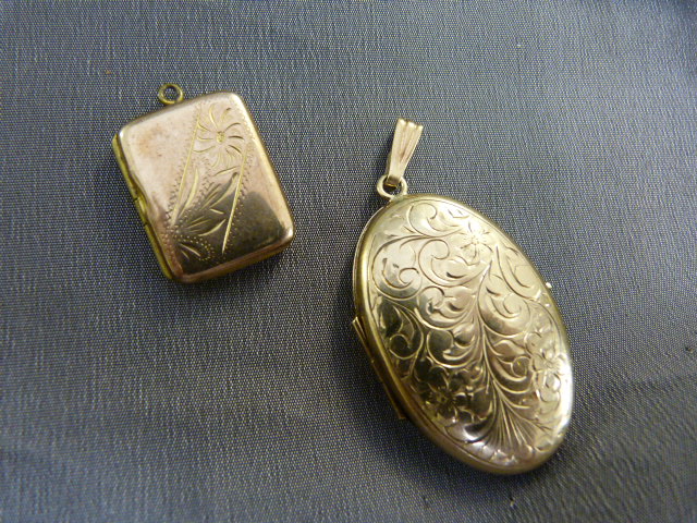 Two gold lockets - 1 ovular locket approx 50.6mm (including bale) x 26mm Wide marked 417 on the